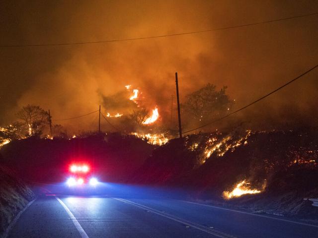 The Colorado Fire burns along Highway 1 near Big Sur, Calif., Friday, Jan. 21, 2022. (AP Photo/Nic Coury)