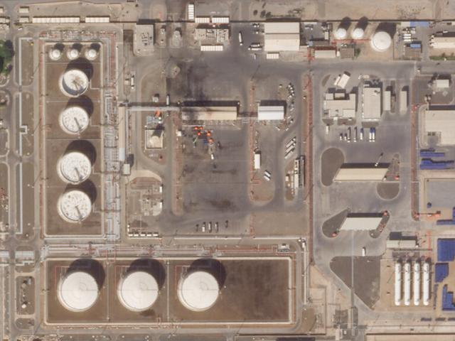 This satellite image provided Planet Labs PBC shows the aftermath of an attack claimed by Yemen&#039;s Houthi rebels on an Abu Dhabi National Oil Co. fuel depot in Abu Dhabi, United Arab Emirates, Saturday, Jan. 22, 2022.  (Planet Labs PBC via AP)