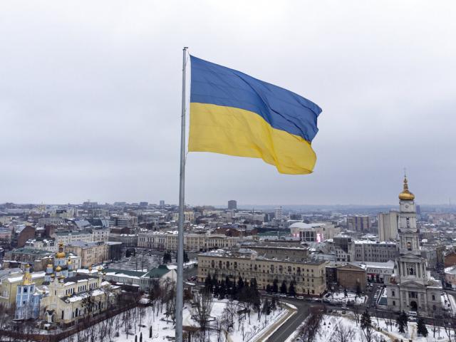 An Ukrainian national flag flag waves over the center of Kharkiv, Ukraine&#039;s second-largest city, Friday, Feb. 4, 2022. (AP Photo/Evgeniy Maloletka)