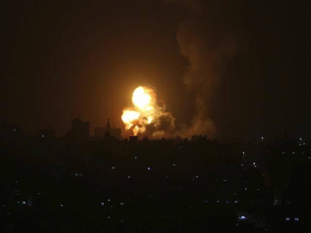 An explosion is caused by Israeli airstrikes on a Hamas military base in town of Khan Younis, southern Gaza Strip, Tuesday April 19, 2022. (AP Photo/Yousef Masoud)