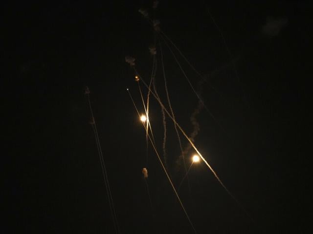 Israel&#039;s Iron Dome air defense system launches missiles to intercept rockets fired from the Gaza Strip toward Israel, over Gaza City, early Thursday, April 21, 2022. (AP Photo/Adel Hana)