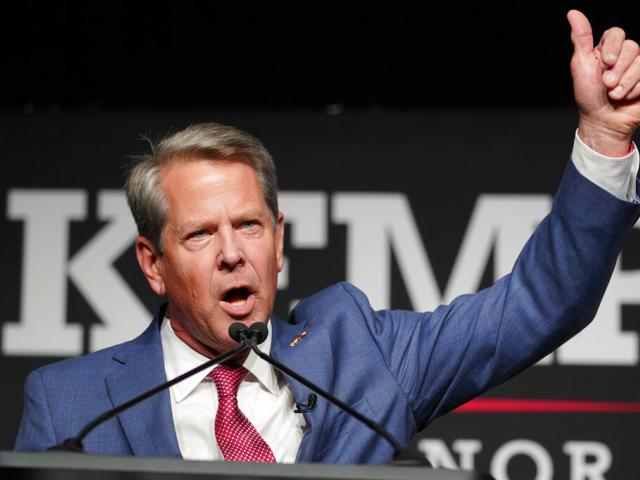 Republican Gov. Brian Kemp waves to supporters during an election night watch party, Tuesday, May 24, 2022, in Atlanta. (AP Photo/John Bazemore)