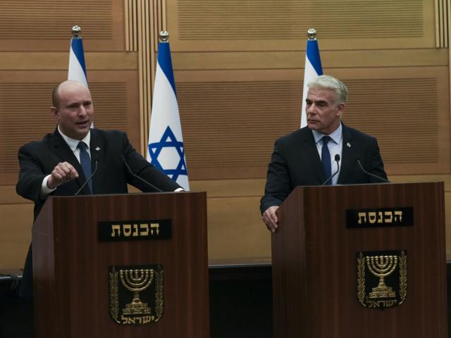 Israeli Prime Minister Naftali Bennett, left, speaks during a joint statement with Foreign Minister Yair Lapid, at the Knesset, Israel&#039;s parliament, in Jerusalem, Monday, June 20, 2022. (AP Photo)