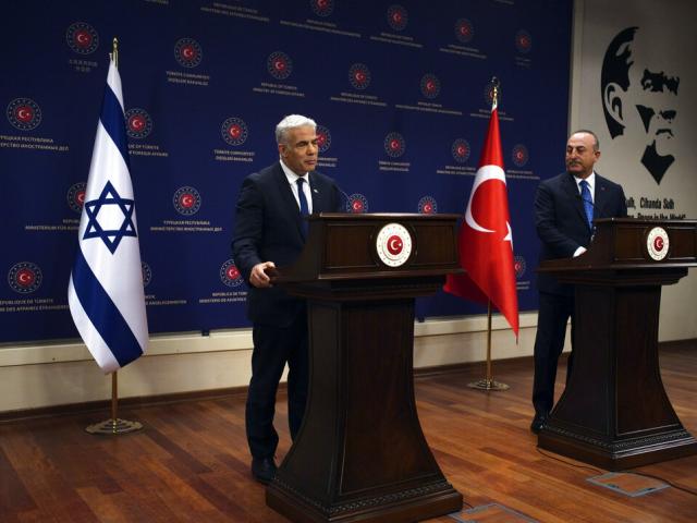File Image: Turkish Foreign Minister Mevlut Cavusoglu, right, and Israeli Prime Minister Yair Lapid speak to the media after their talks, in Ankara, Turkey, Thursday, June 23, 2022. (AP Photo/Burhan Ozbilici)
