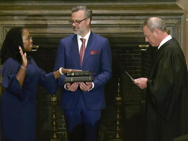 In this image from video provided by the Supreme Court, Chief Justice of the United States John Roberts administers the Constitutional Oath to Ketanji Brown Jackson. (Supreme Court via AP)