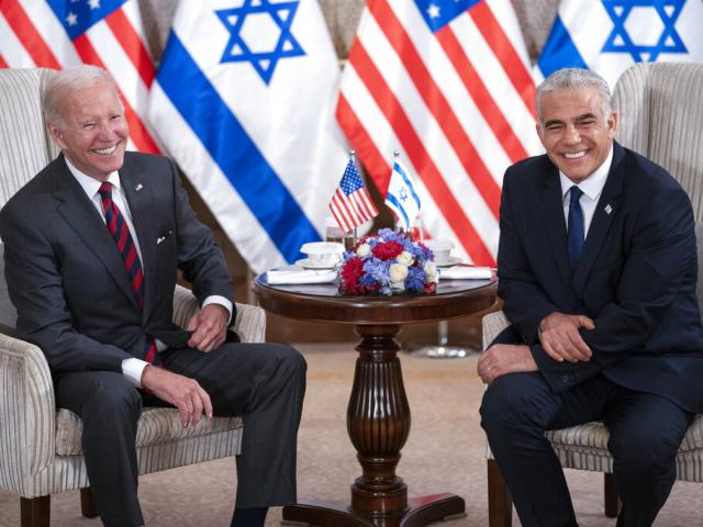 President Joe Biden, left, and Israeli Prime Minister Yair Lapid address the media following their meeting in Jerusalem Thursday, July 14, 2022. (AP Photo/Evan Vucci)