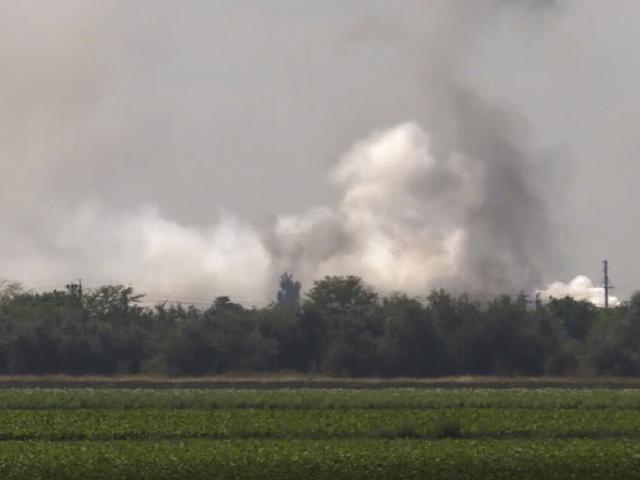 In this image taken from video provided by the RU-RTR Russian television on Tuesday, Aug. 16, 2022, smoke rises over the site of explosion at an ammunition storage of Russian army. (RU-RTR Russian Television via AP)