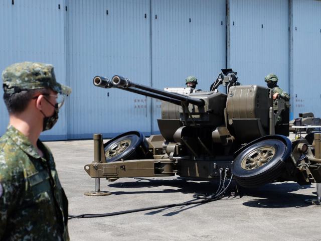 Taiwanese soldiers operate a Oerlikon 35mm twin cannon anti-aircraft gun at a base in Taiwan&#039;s southeastern Hualien county on Thursday, Aug. 18, 2022. (AP Photo/Johnson Lai)