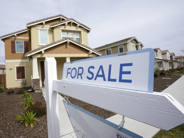 A for sale sign is posted in front of a home in Sacramento, Calif., Thursday, March 3, 2022. (AP Photo/Rich Pedroncelli, File)