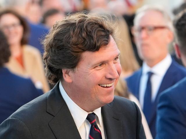 Tucker Carlson talks after President Trump posthumously awarded the Presidential Medal of Freedom to Charlie Kirk in the Rose Garden of the White House, Oct. 14, 2025. (AP Photo/Alex Brandon) Tucker Carlson talks after President Trump posthumously awarded the Presidential Medal of Freedom to Charlie Kirk in the Rose Garden of the White House, Oct. 14, 2025. (AP Photo/Alex Brandon)