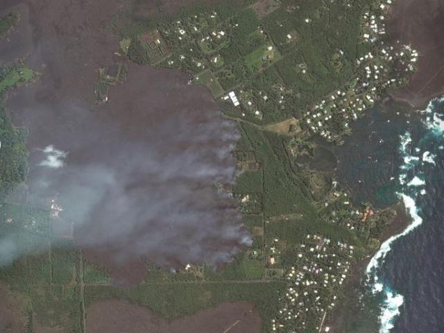 This satellite image provided by Digital Globe captured June 3, 2018, shows advancing lava flows on Hawaii as they approach Kapoho Bay and the Vacationland residential neighborhood.