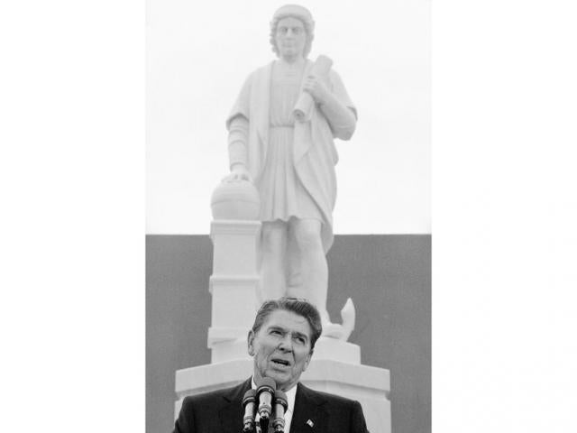 In this, Oct. 9, 1984, file photo, President Ronald Reagan addresses a ceremony in Baltimore, to unveil a statue of Christopher Columbus (AP Photo/Lana Harris, File)
