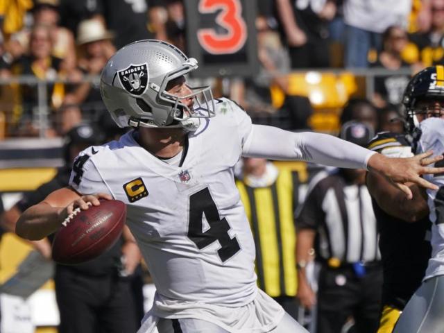 Las Vegas Raiders quarterback Derek Carr (4) throws a touchdown pass to wide receiver Henry Ruggs III during the second half of an NFL football game against the Pittsburgh Steelers in Pittsburgh, Sunday, Sept. 19, 2021. (AP Photo/Keith Srakocic)