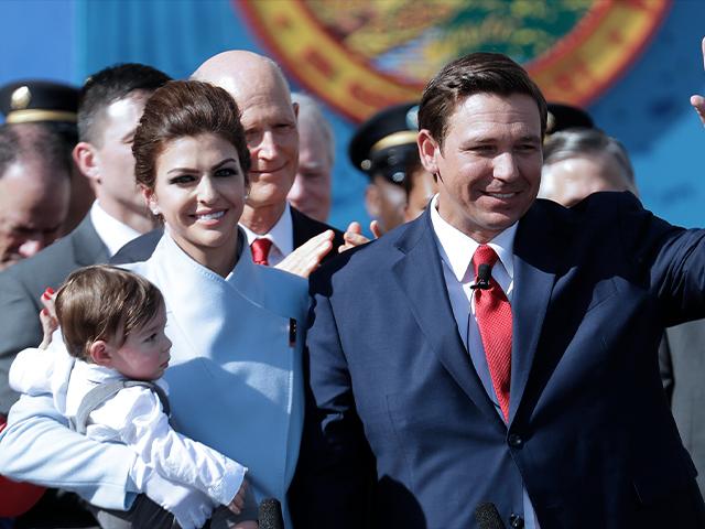 Florida Governor Ron DeSantis waves during an inauguration ceremony with his wife Casey and son Mason, Jan. 8, 2019, in Tallahassee, FL (AP Photo/Lynne Sladky)