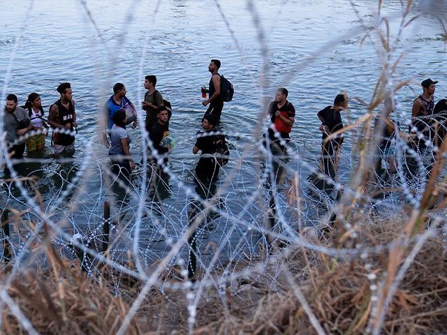 Migrants cross the Rio Grande and enter the U.S. from Mexico, Sept. 23, 2023, in Eagle Pass, Texas. (AP Photo/Eric Gay, File)