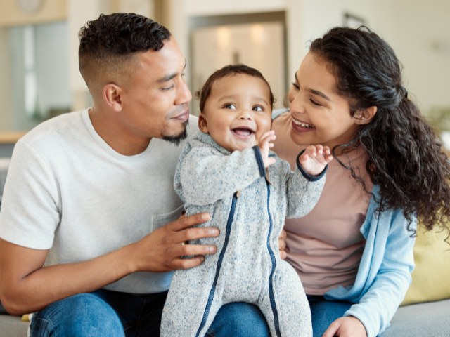 happy baby with mother and father