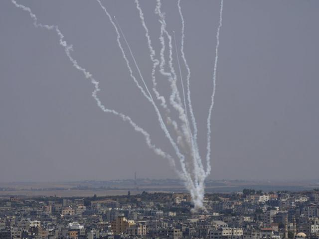 Rockets are launched from the Gaza Strip towards Israel, in Gaza City, Saturday, Aug. 6, 2022. (AP Photo/Hatem Moussa)