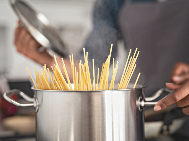 cooking spaghetti in a pot