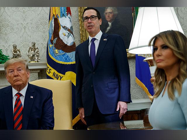 President Donald Trump and first lady Melania Trump listen as Treasury Secretary Steve Mnuchin announces sanctions on Iran in the Oval Office of the White House, Friday, Sept. 20, 2019. (AP Photo)