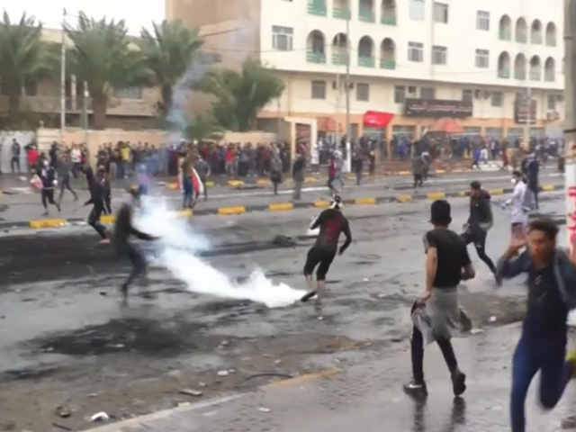 AP: Protesters running and kicking away teargas canisters in the city of Najaf. 1 December 2019