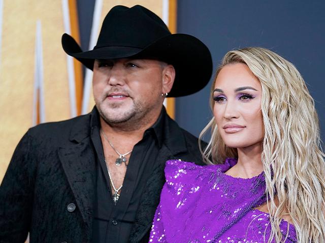 Jason Aldean, left, and Brittany Kerr arrive at the 57th Academy of Country Music Awards on Monday, March 7, 2022, at Allegiant Stadium in Las Vegas. (AP Photo/Eric Jamison)