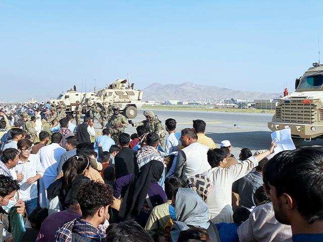 Thousands of Afghans trapped by the sudden Taliban takeover rushed the tarmac in Kabul and clung to U.S. military planes (AP Photo/Shekib Rahmani)