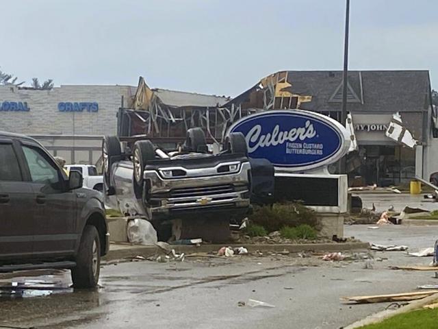 This image provided by Steven Bischer, shows an upended vehicle following an apparent tornado, Friday, May 20, 2022, in Gaylord, Mich. (Steven Bischer via AP)