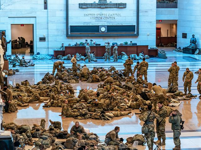 Hundreds of National Guard troops hold inside the Capitol Visitor&#039;s Center to reinforce security at the Capitol in Washington, Wednesday, Jan. 13, 2021.