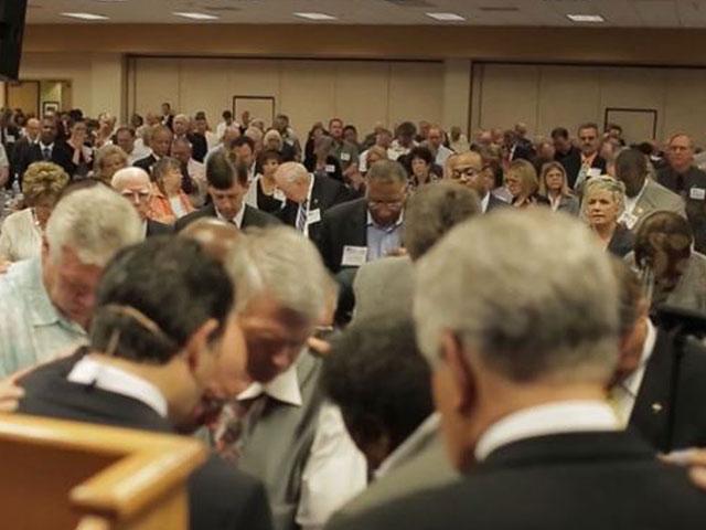 Screenshot of pastors praying together at a previous &quot;Pastors and Pews&quot; event. (Image credit: CBN News)
