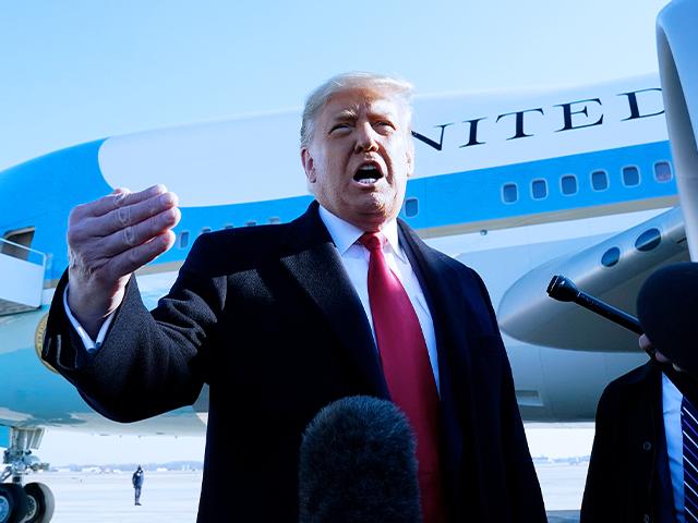 President Donald Trump speaks to the media before boarding Air Force One, at Andrews Air Force Base, Md. The President is traveling to Texas. (AP Photo/Alex Brandon)