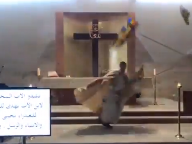Screenshot of footage of priest in Beirut running for cover amid deadly explosion