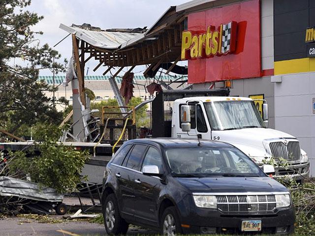 The aftermath of tornado damage to Advance Auto Parts on 41st Ave, is seen, Wednesday, Sept. 11, 2019, in Sioux Falls, S.D. (Erin Bormett/The Argus Leader via AP)