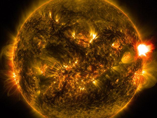 NASA photo from Jan. 12, 2015 shows a notable solar flare - the kind of celestial event that could interfere with electric grids on Earth.  
