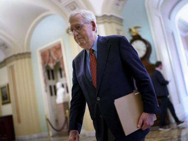 Senate Minority Leader Mitch McConnell, R-Ky., walks to the chamber for a test vote on a government spending bill, at the Capitol in Washington, Monday, Sept. 27, 2021. (AP Photo/J. Scott Applewhite)