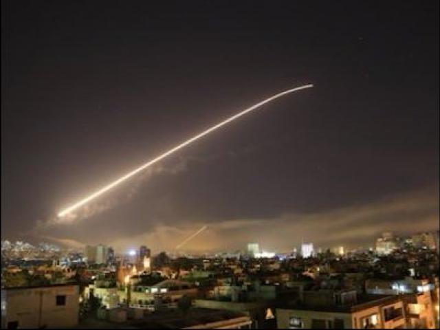 Syria’s capital has been rocked by loud explosions that lit up the sky with heavy smoke as U.S. President Donald Trump announced airstrikes in retaliation for the country’s alleged use of chemical weapons. (AP Photo/Hassan Ammar)