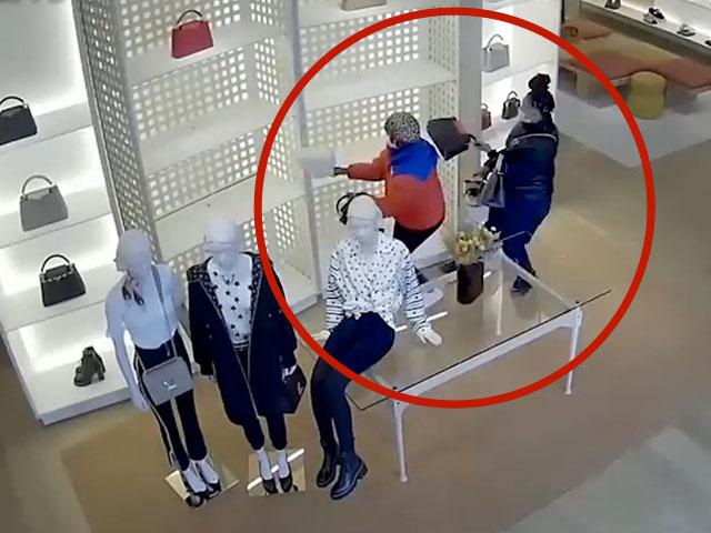 Surveillance footage shows brazen shoplifters robbing a store