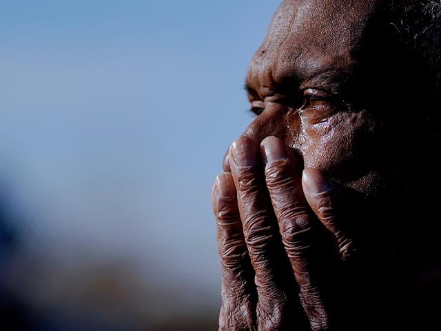 Ezell Williams cries while talking about the tornado damage caused to his properties and those of his neighbors, Sunday, March 26, 2023, in Rolling Fork, Miss. (AP Photo/Julio Cortez)