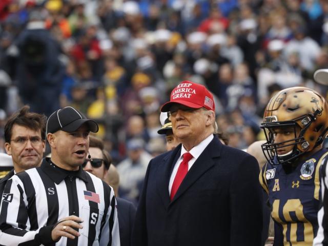 President Donald Trump waits for the coin toss before the start of the Army-Navy college football game in Philadelphia, Saturday, Dec. 14, 2019. (AP Photo/Jacquelyn Martin)