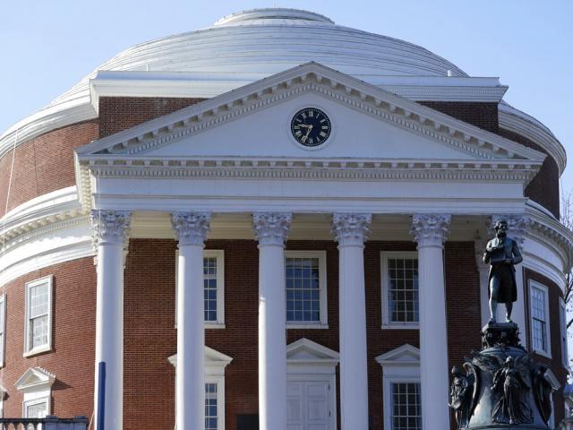 A statue of University of Virginia founder, Thomas Jefferson, stands watch over the Rotunda near the scene of an overnight shooting at the University of Virginia Monday, Nov. 14, 2022, in Charlottesville. Va. (AP Photo/Steve Helber)