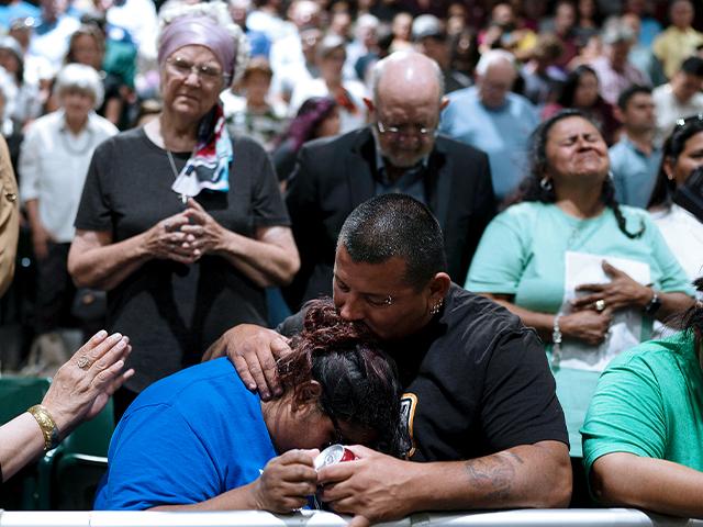 Two family members of one of the victims killed in Tuesday&#039;s shooting at Robb Elementary School comfort each other during a prayer vigil in Uvalde, Texas, Wednesday, May 25, 2022. (AP Photo/Jae C. Hong)
