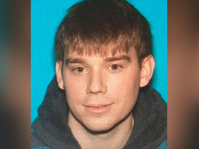 This photo provided by the Metro Nashville Police Department shows Travis Reinking, who police took into custody Monday in connection with a fatal shooting at a Waffle House restaurant in the Antioch neighborhood of Nashville early Sunday.