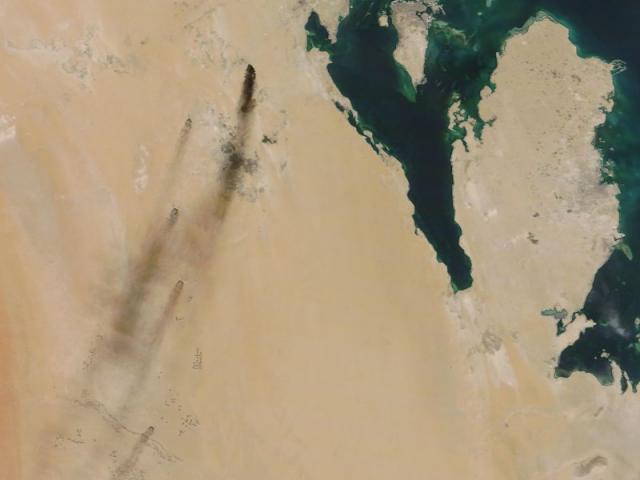 Satellite image provided by NASA Worldview shows fires following Yemen's Houthi rebels claiming a drone attack on two major oil installations in eastern Saudi Arabia (NASA Worldview via AP)