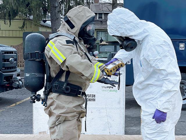 Ohio National Guard, ONG 52nd Civil Support Team members prepare to enter an incident area to assess remaining hazards with a lightweight inflatable decontamination system (LIDS) in East Palestine, Ohio, Feb. 7, 2023. (Ohio National Guard via AP)