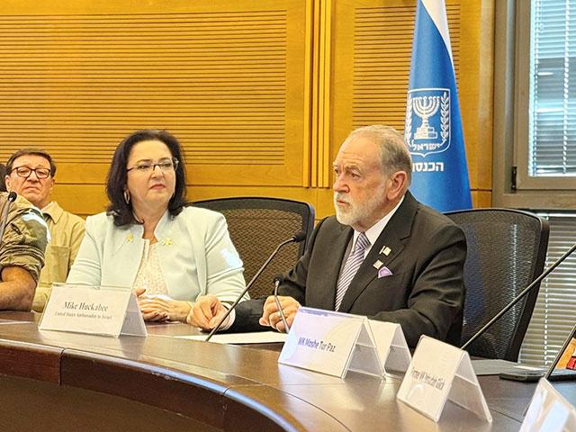 U.S. Ambassador to Israel Mike Huckabee addresses guests and Knesset members at the “Pray for the Peace of Jerusalem” event. Photo Credit: CBN News.