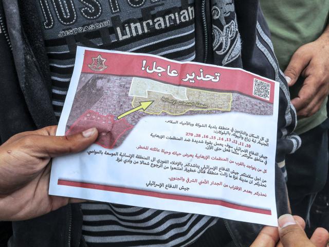 Leaflet dropped by Israeli military warns residents in the city of Rafah to evacuate and move towards the west of the city and the safe city of Khan Yunis. (Photo by: Abed Rahim Khatib/picture-alliance/dpa/AP Images)