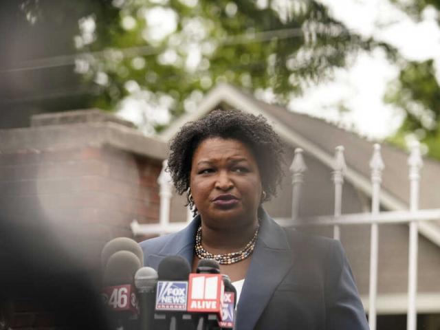 Georgia Democratic gubernatorial candidate Stacey Abrams talks to the media during the Georgia&#039;s Primary election on Tuesday, May 24, 2022, in Atlanta. (AP Photo/Brynn Anderson)