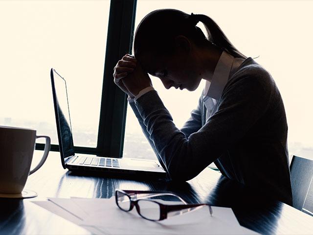 Stressed Woman on Computer