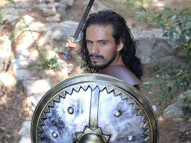 long-haired warrior with sword and shield