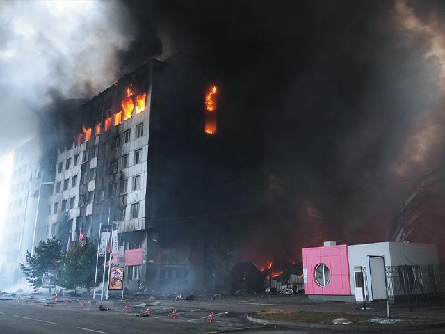 A building burns after shelling in Kyiv, Ukraine, Thursday, March 3, 2022. Russian forces have escalated their attacks on crowded cities in what Ukraine's leader called a blatant campaign of terror. (AP Photo/Efrem Lukatsky)