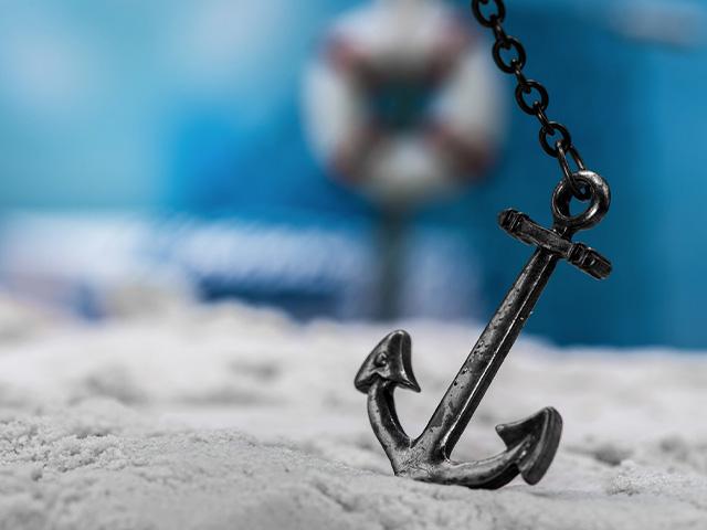 an anchor on a beach